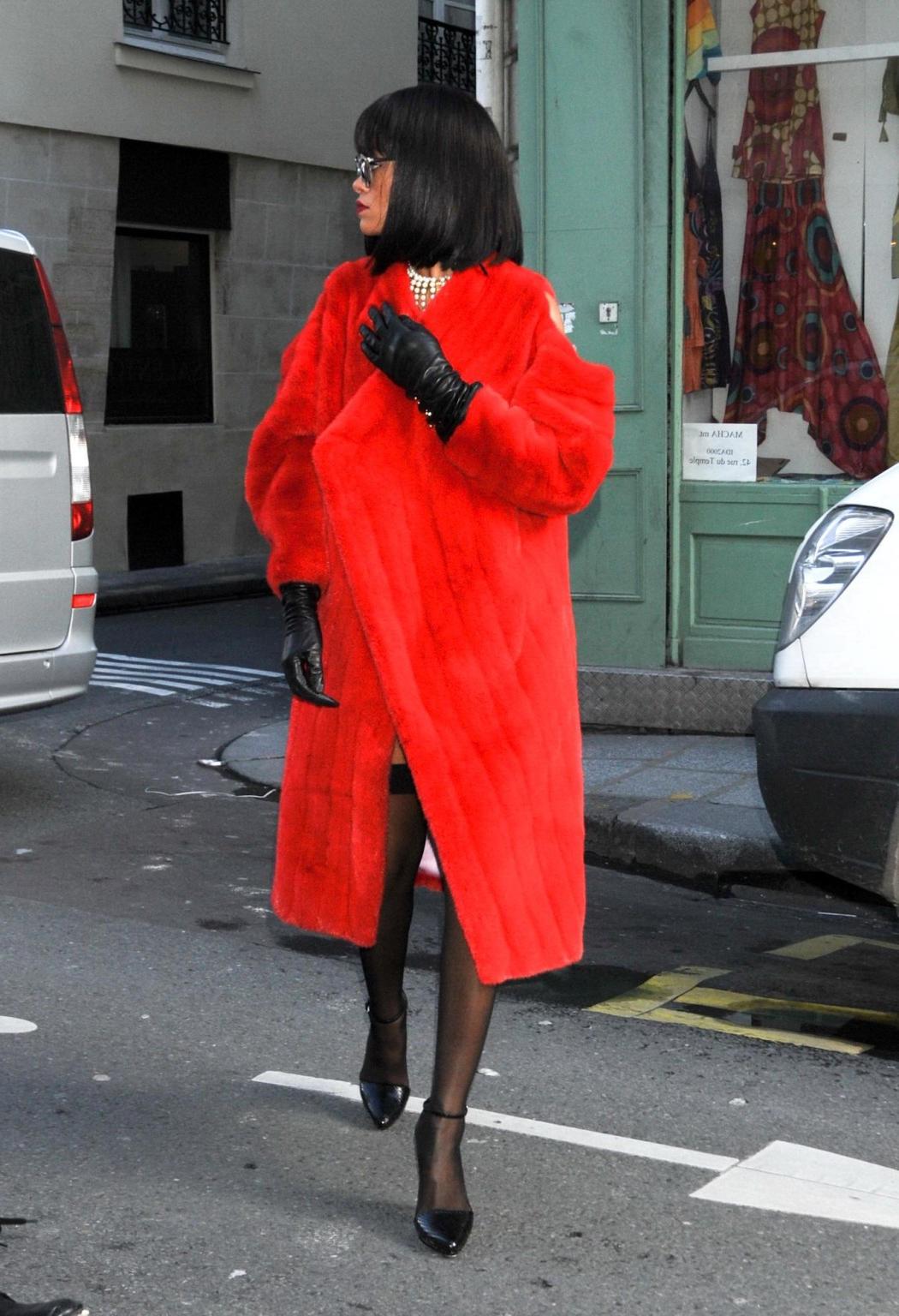 16P Rihanna showing off her stockings and cleavage at the Christian Dior fashion sho