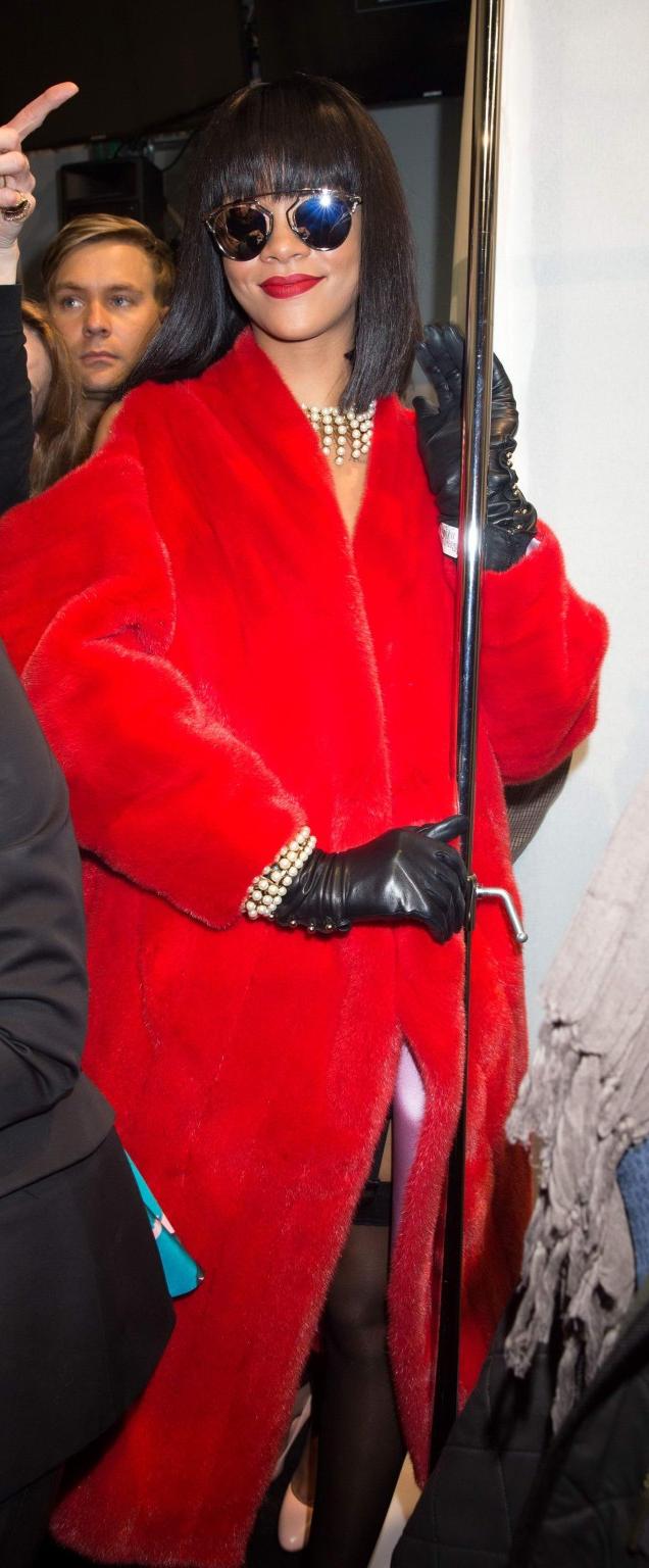 16P Rihanna showing off her stockings and cleavage at the Christian Dior fashion sho
