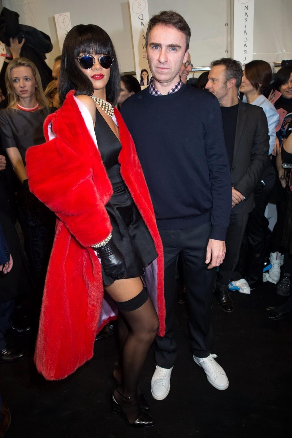 16P Rihanna showing off her stockings and cleavage at the Christian Dior fashion sho