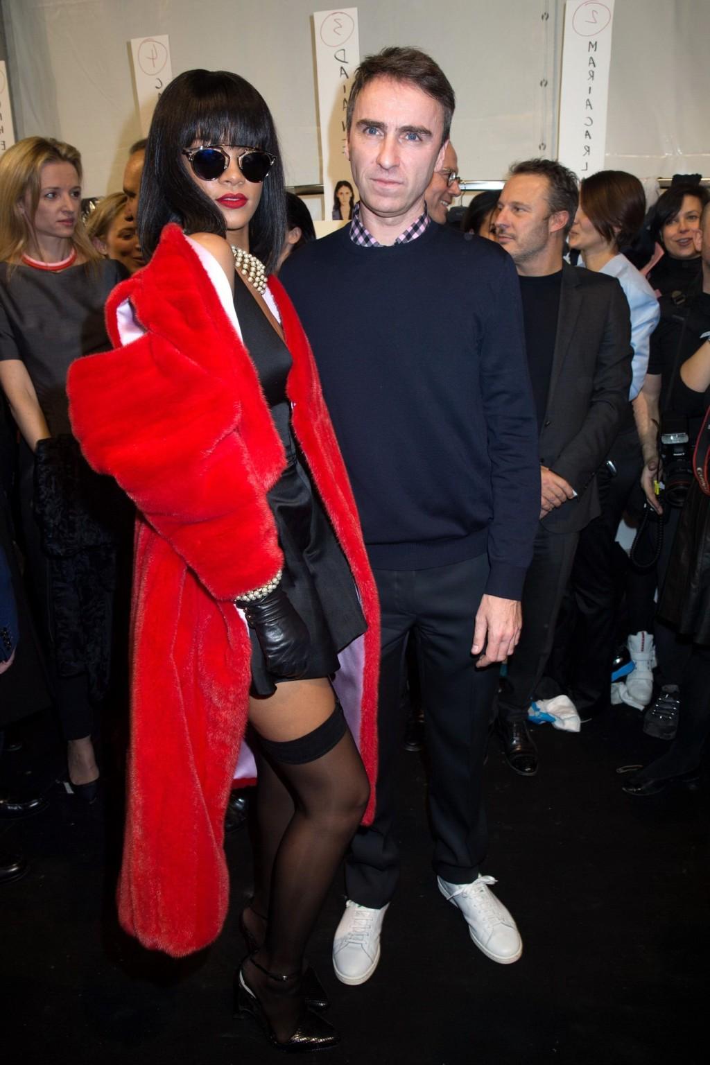 16P Rihanna showing off her stockings and cleavage at the Christian Dior fashion sho