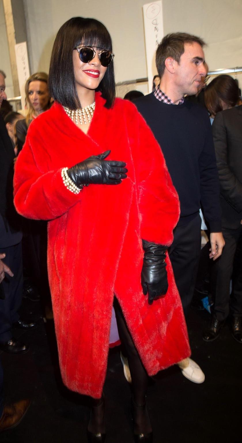 16P Rihanna showing off her stockings and cleavage at the Christian Dior fashion sho