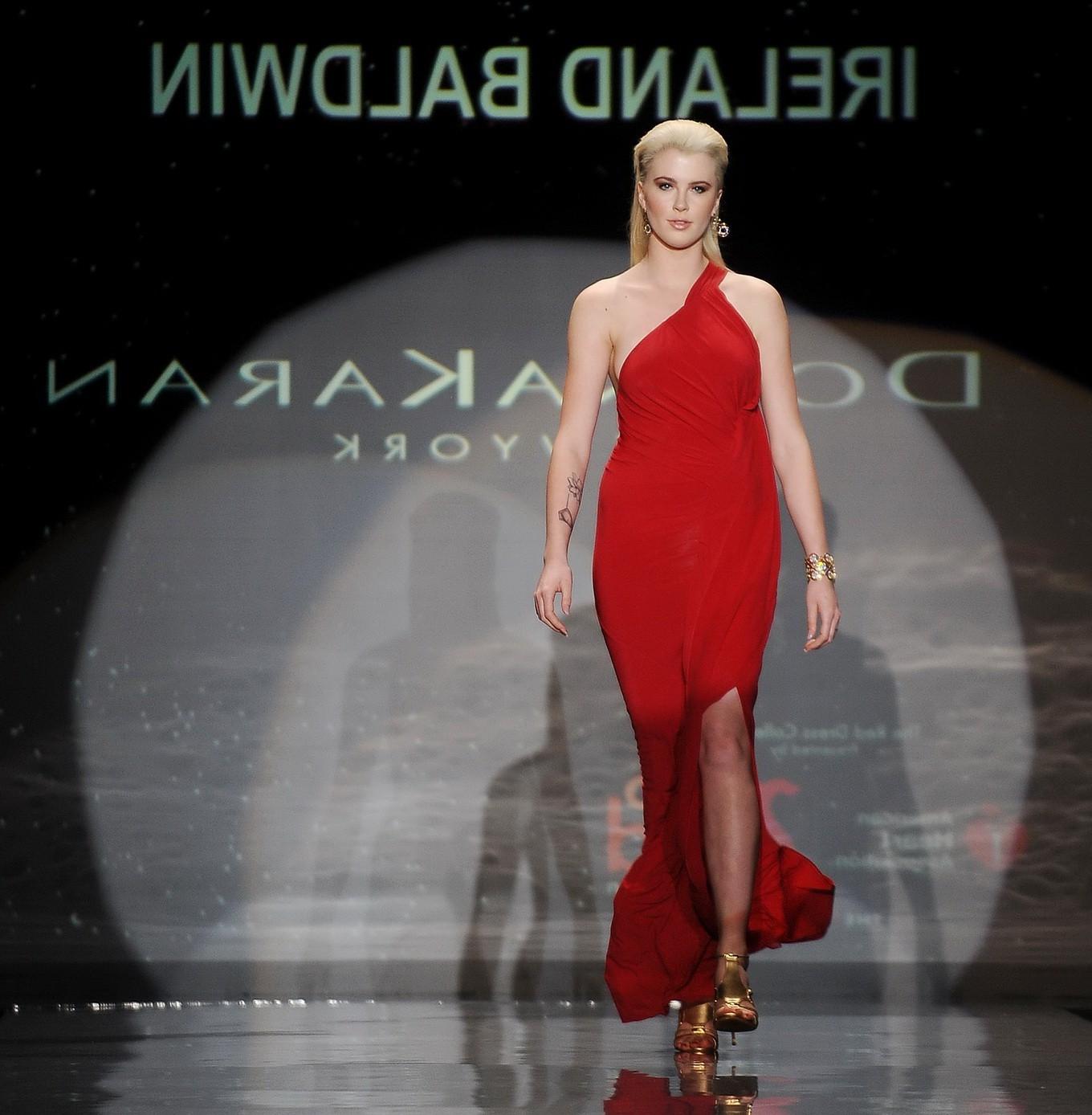 16P Ireland Baldwin braless in a revealing dress at The Heart Truth Red Dress Collec
