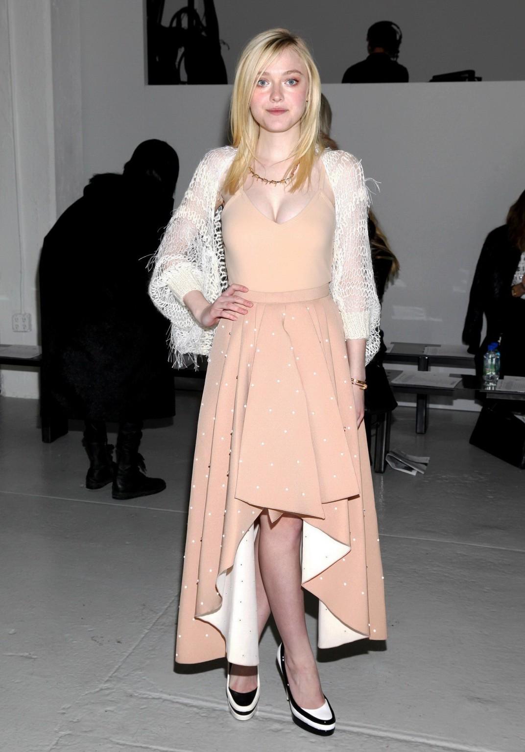 16P Dakota Fanning braless showing big cleavage in a flesh colored top and skirt at 