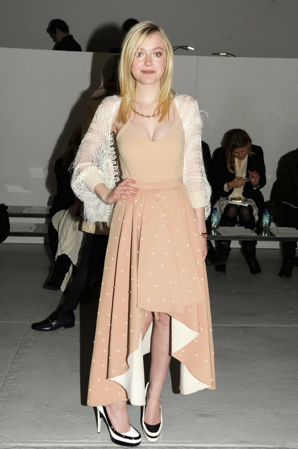 16P Dakota Fanning braless showing big cleavage in a flesh colored top and skirt at 