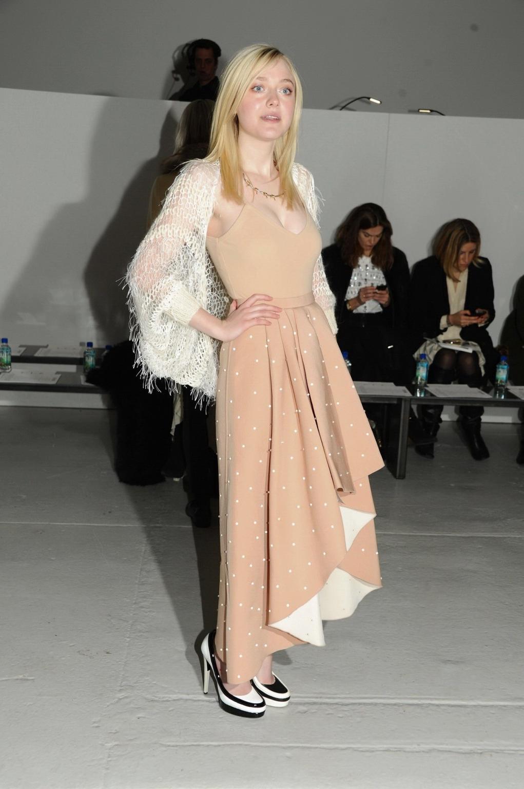 16P Dakota Fanning braless showing big cleavage in a flesh colored top and skirt at 