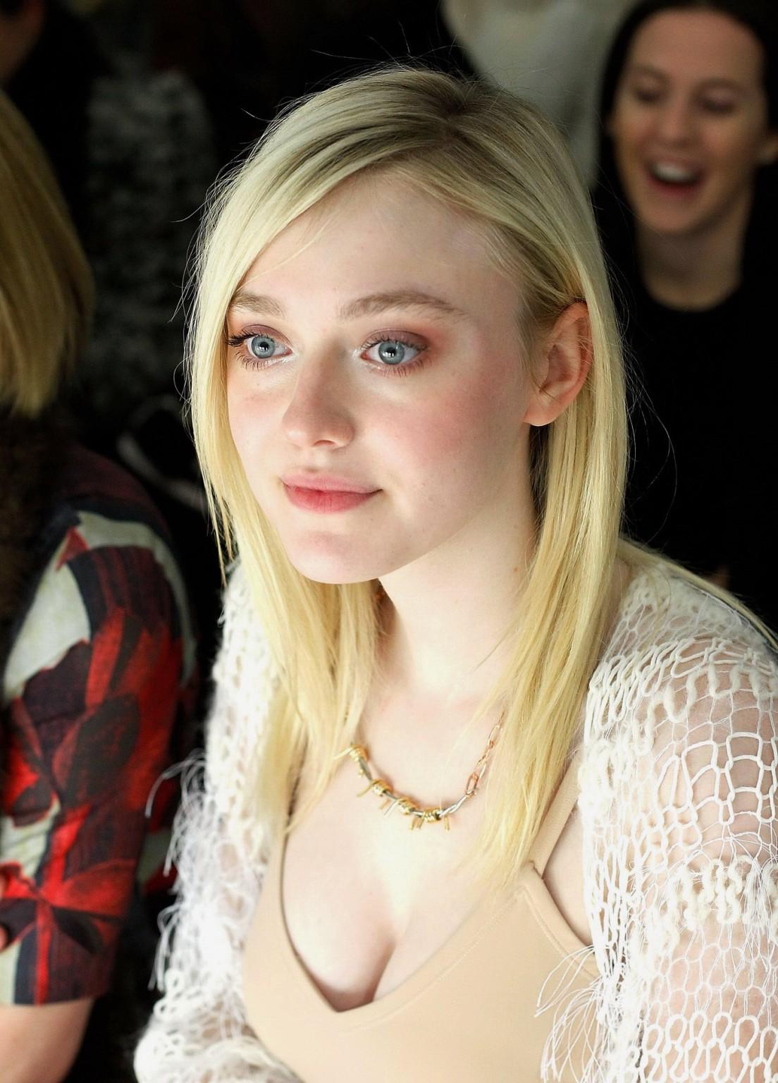 16P Dakota Fanning braless showing big cleavage in a flesh colored top and skirt at 