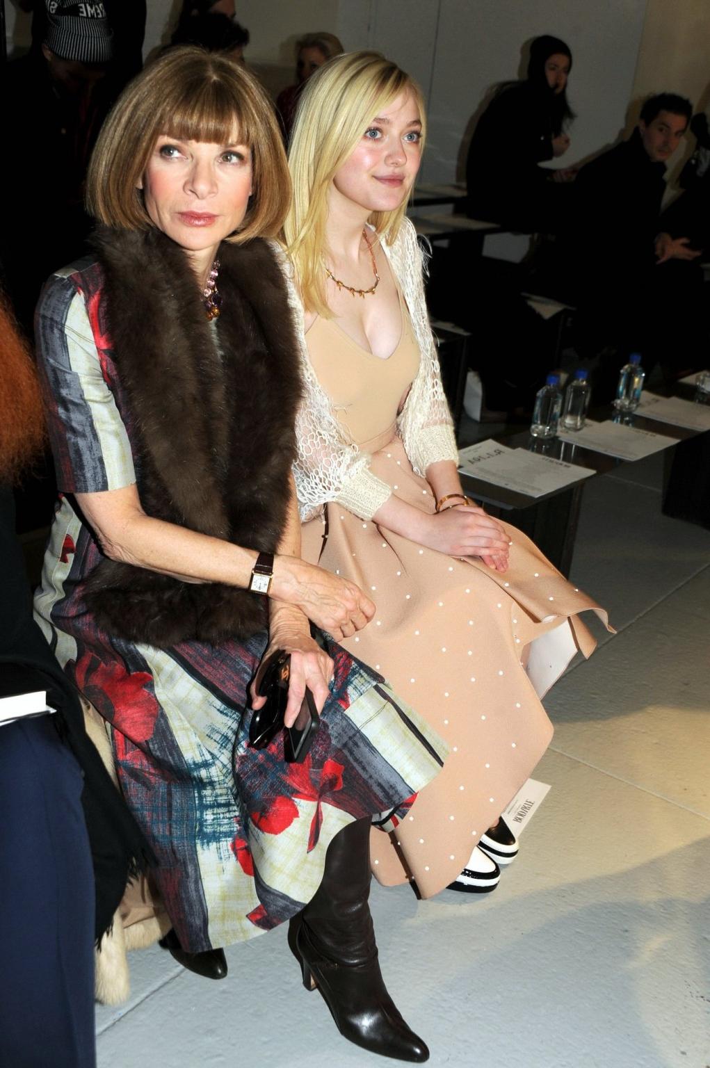 16P Dakota Fanning braless showing big cleavage in a flesh colored top and skirt at 