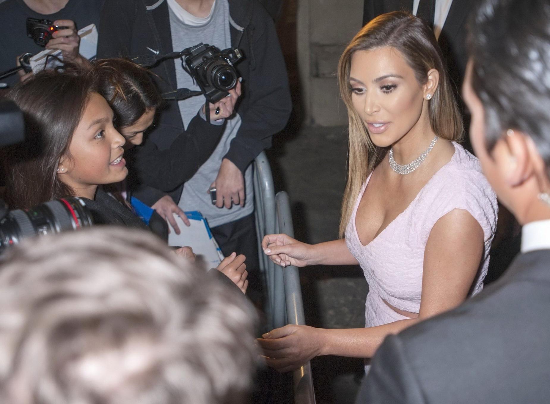 16P Kim Kardashian shows cleavage and booty while arriving to 'Jimmy Kimmel Live' in