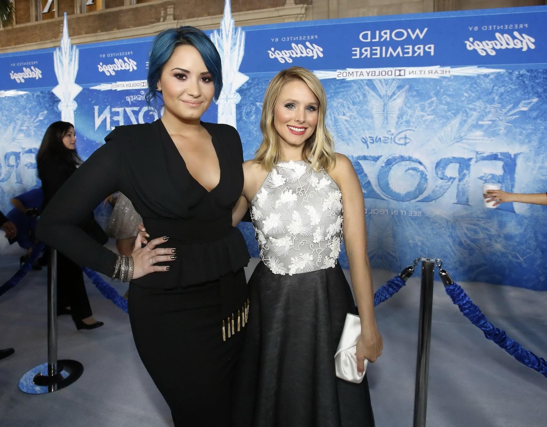 16P Demi Lovato braless showing big cleavage in a tight black outfit at the Frozen p