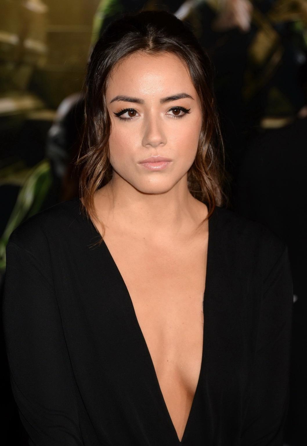 16P Chloe Bennet braless showing huge cleavage in a short black outfit at the Thor:T