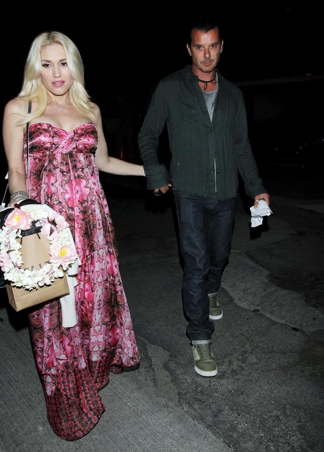 16P Gwen Stefani shows off her breast implants wearing a strapless dress outside a f