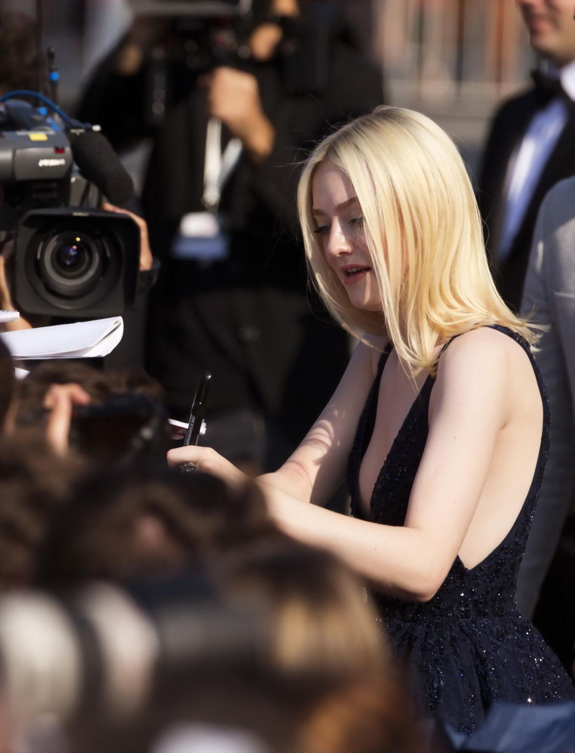 16P Dakota Fanning braless showing huge cleavage in shiny black dress at Night Moves