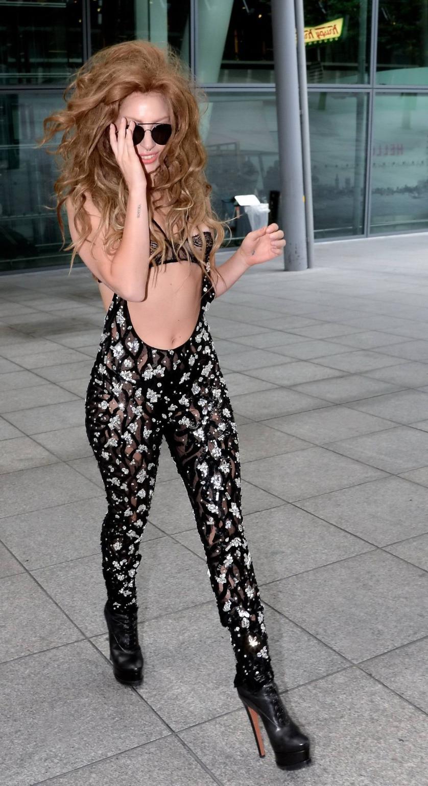 16P Lady Gaga wearing see-through lingerie and pants at Heathrow Airport in London
