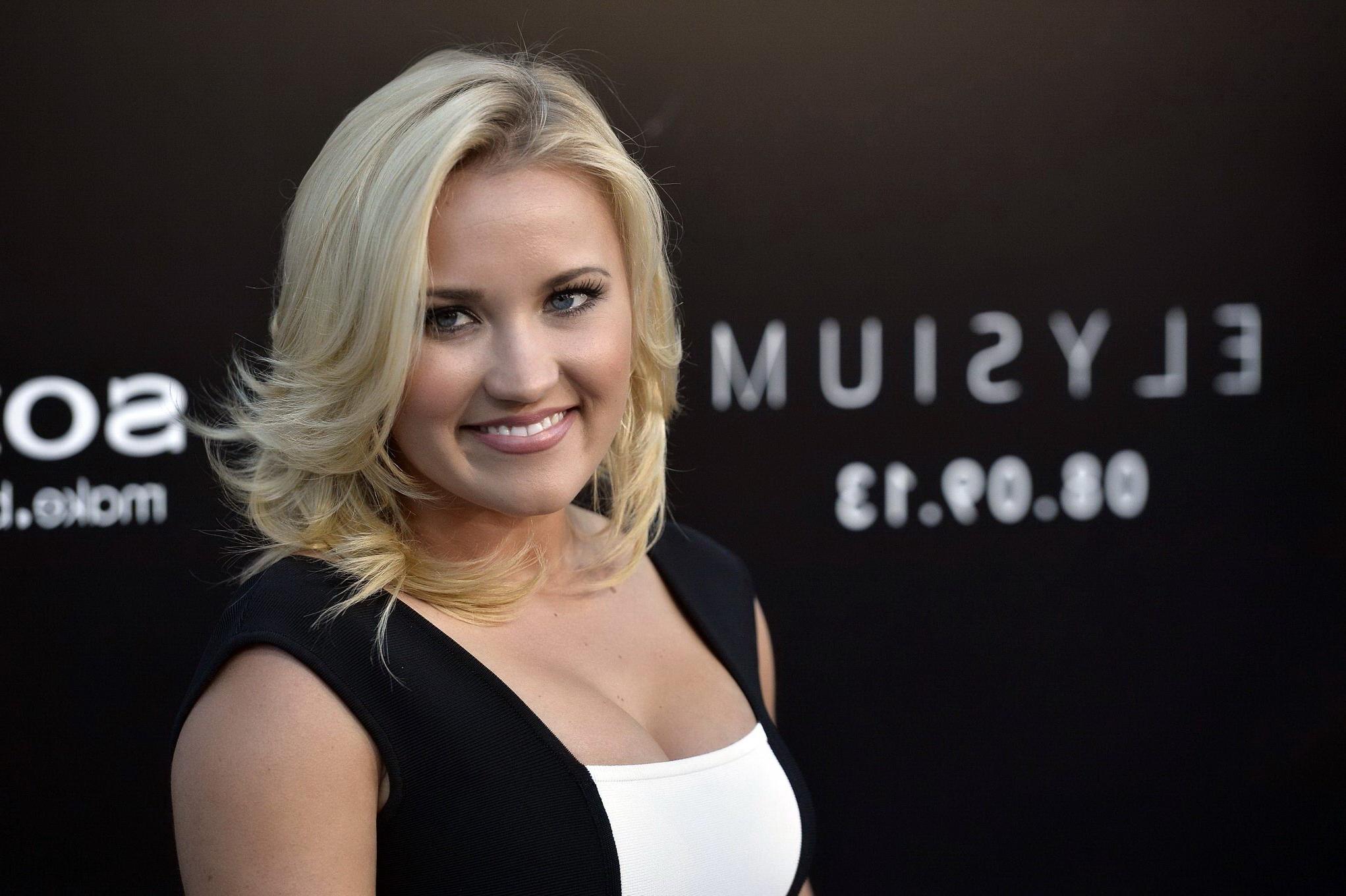 16P Emily Osment showing cleavage at the 'Elysium' premiere in Westwood