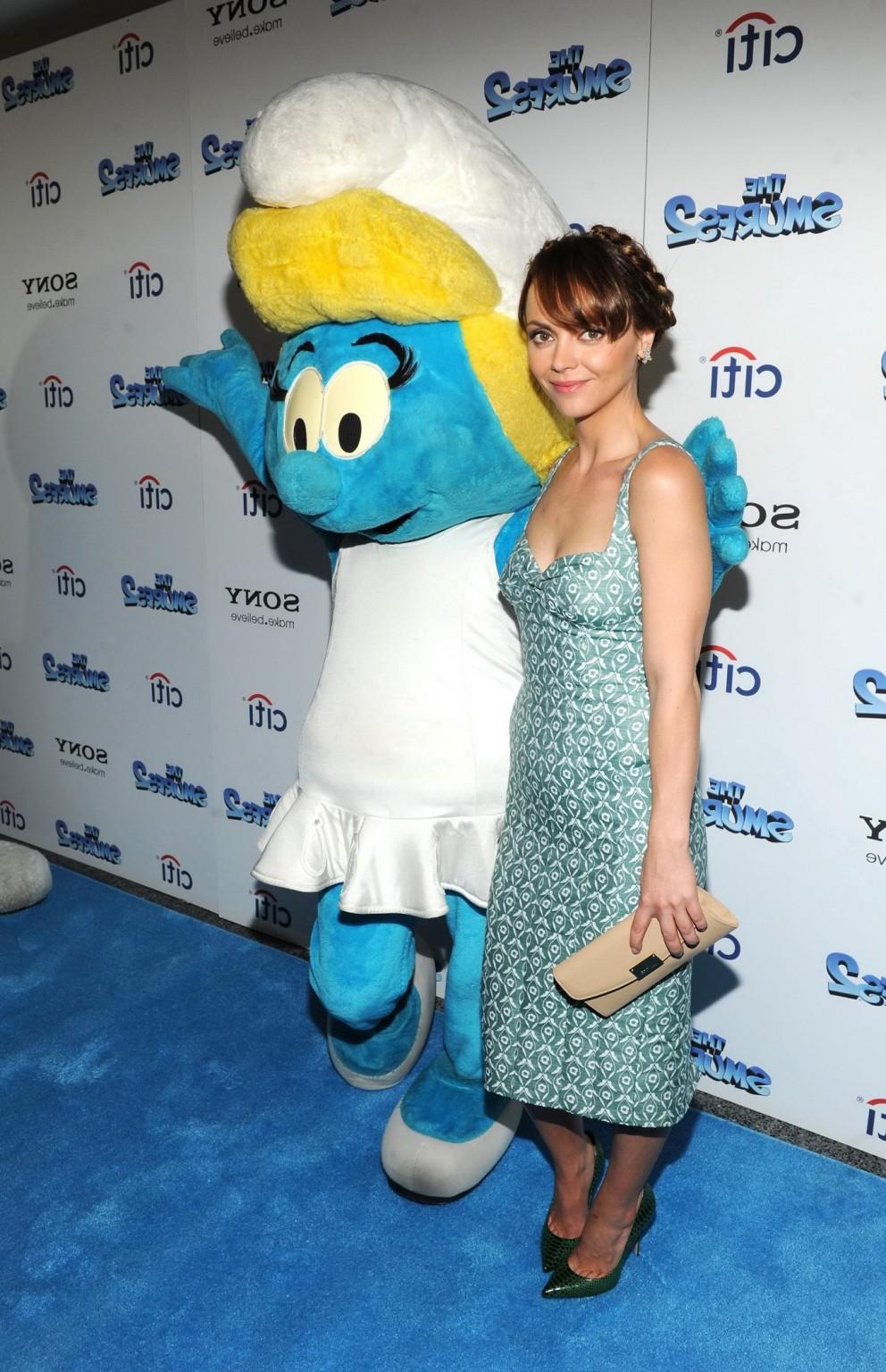 16P Christina Ricci showing big cleavage in a low cut indeterminate colored dress at