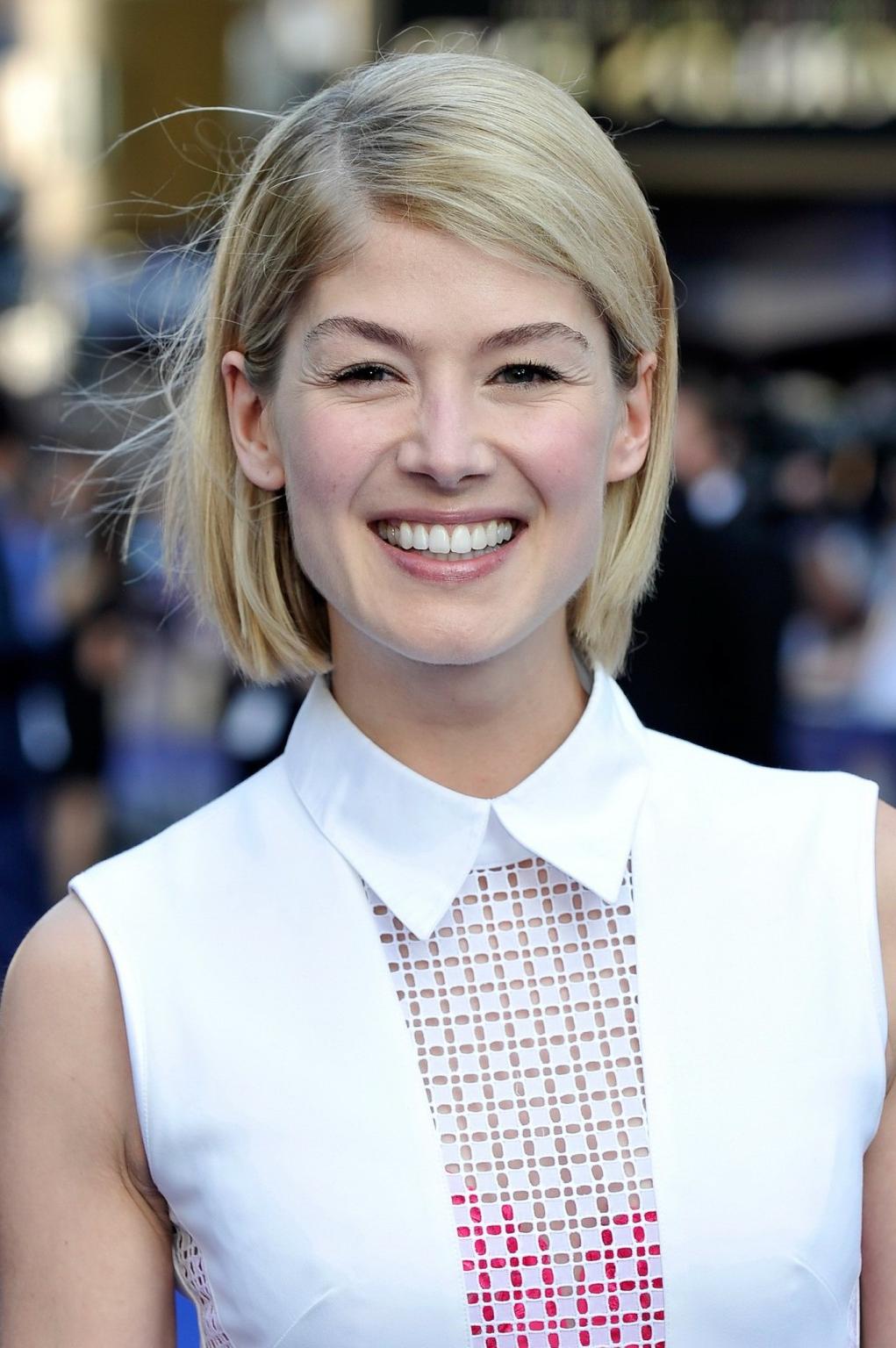 7P Rosamund Pike showing big see-through cleavage in a short tight white dress at T
