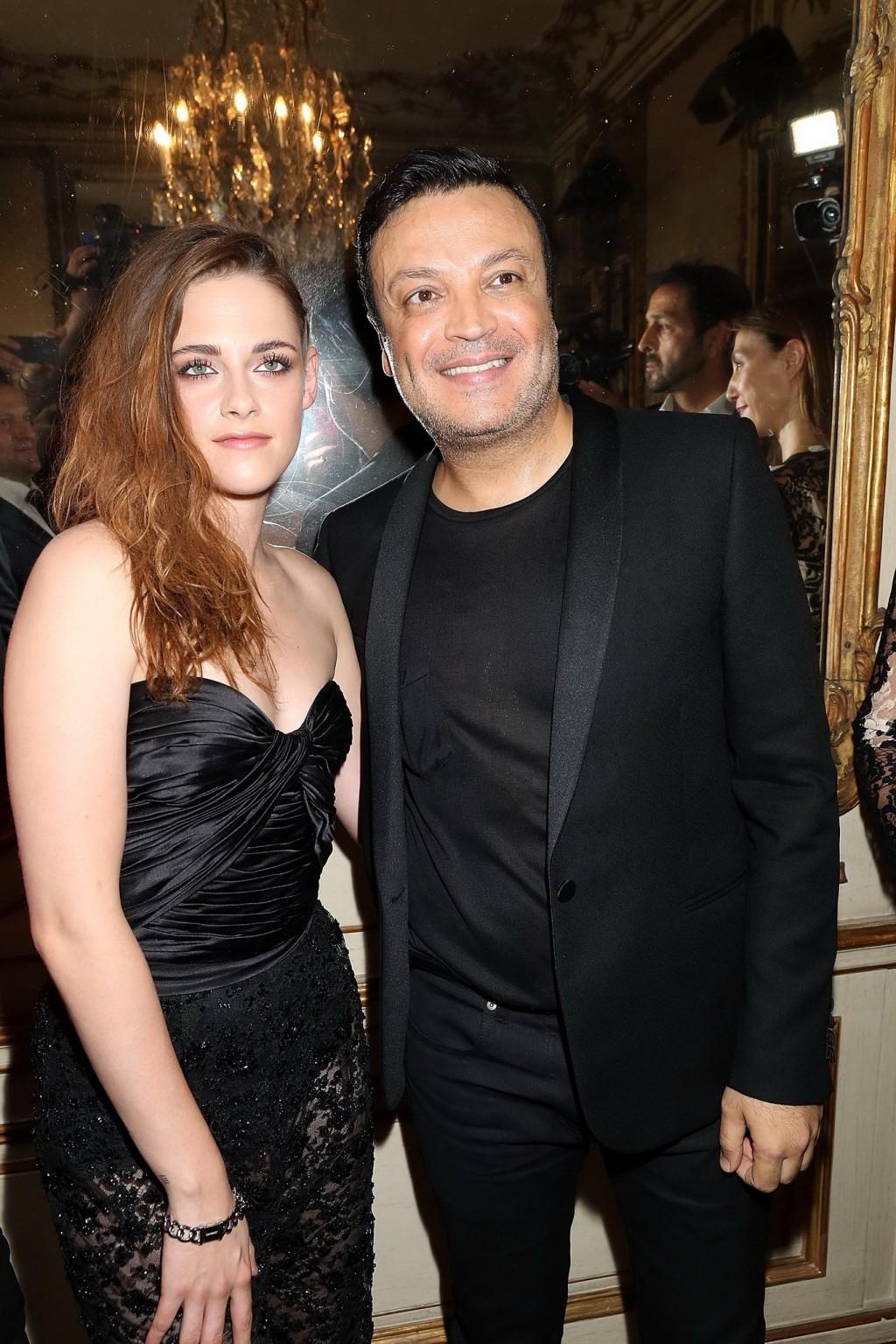16P Kristen Stewart showing huge cleavage in black tube top and see-through pants at