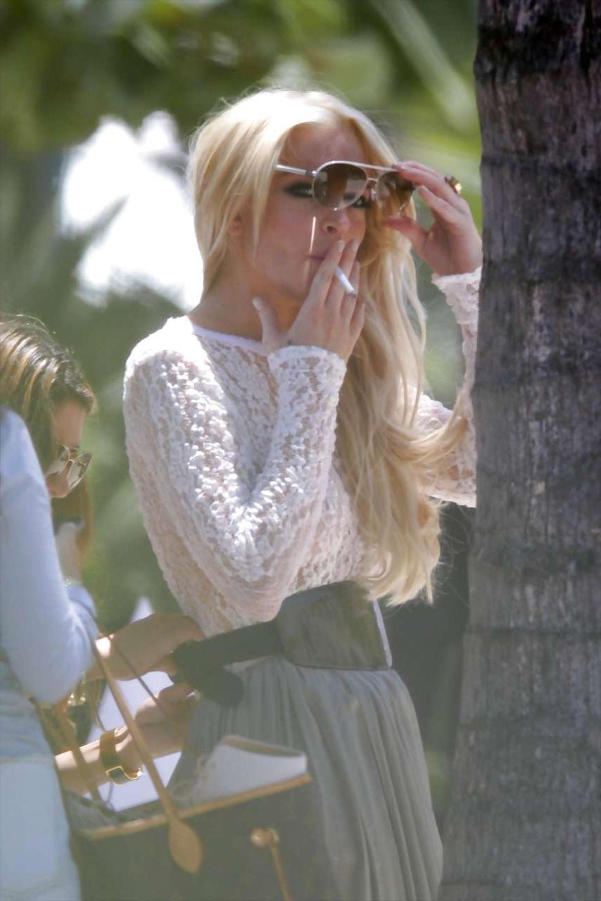 16P Lindsay Lohan exposing niples slip and see thru on street