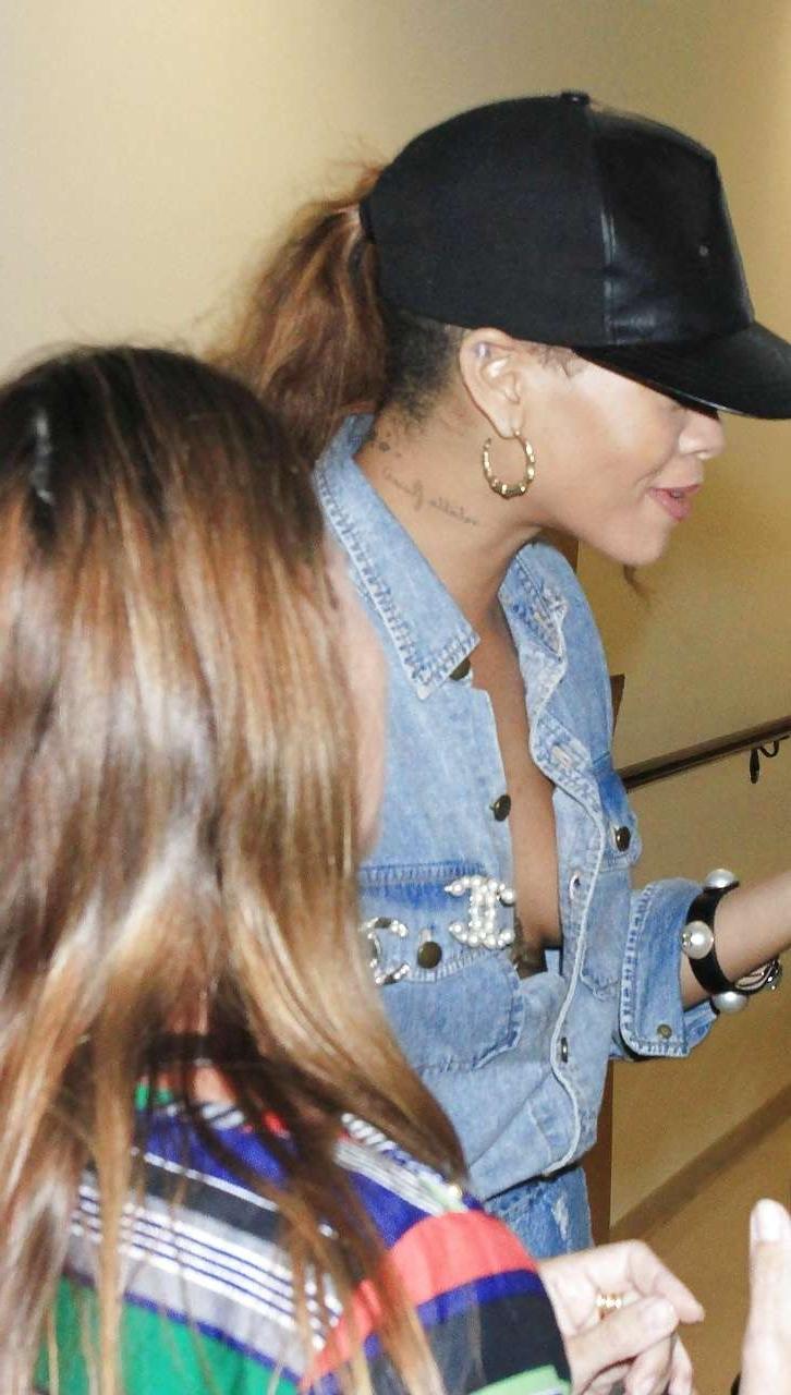 16P Rihanna looking sexy and exposing huge cleavage on street