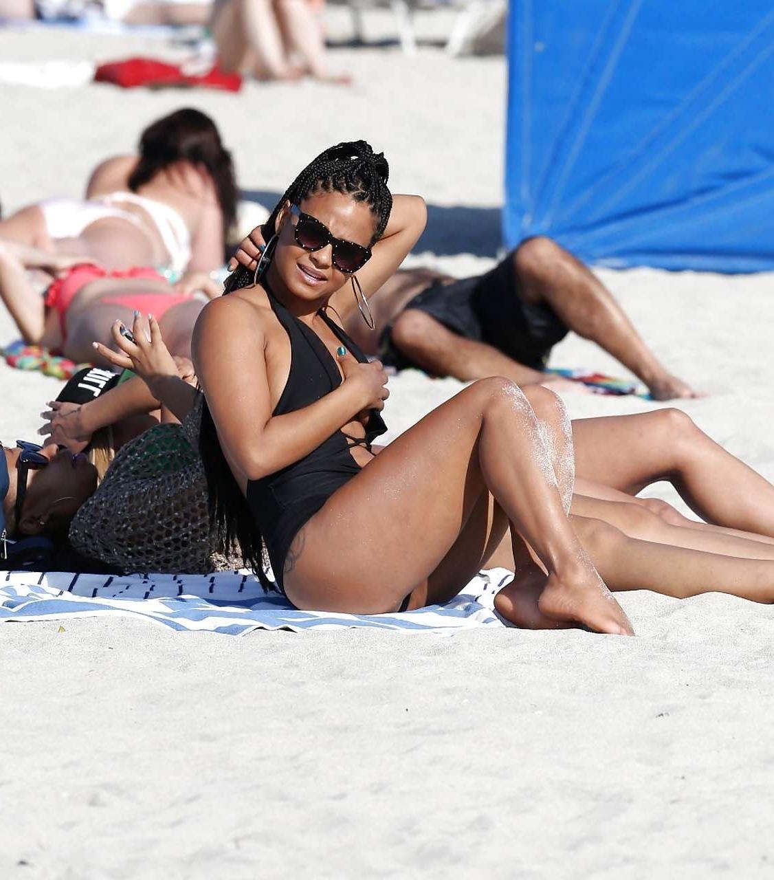 16P Christina Milian exposing nipples slip in bikini on beach
