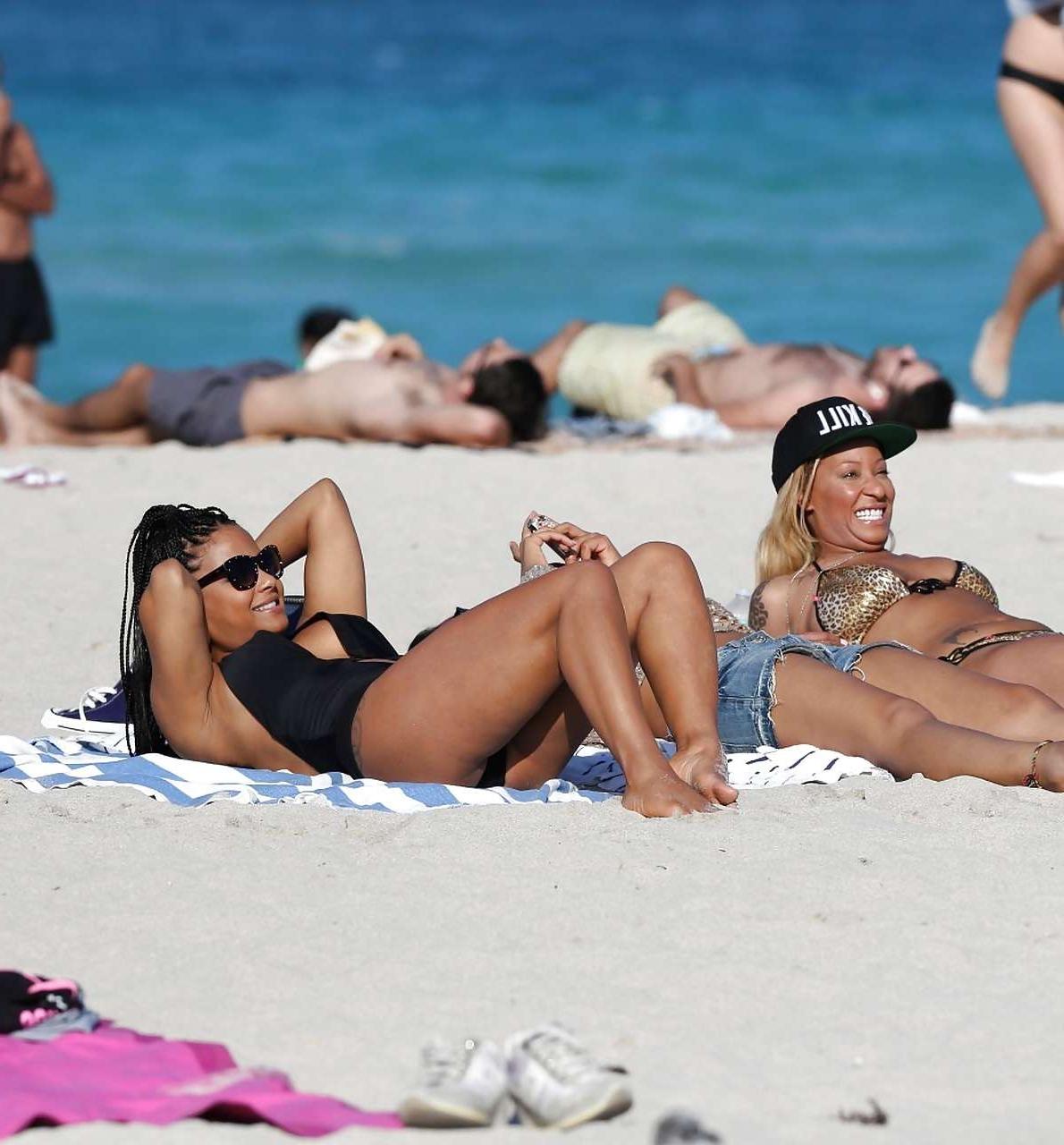 16P Christina Milian exposing nipples slip in bikini on beach