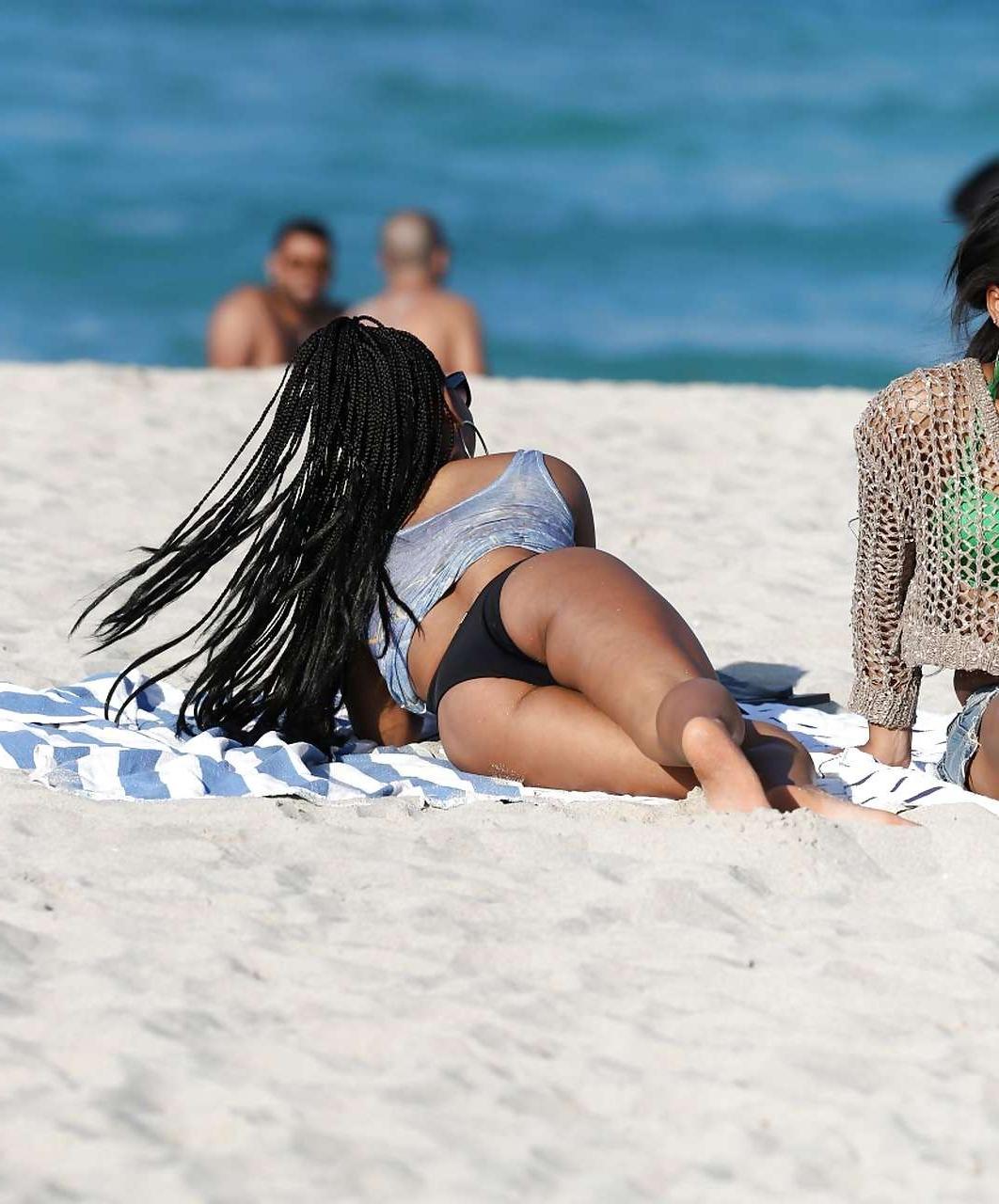 16P Christina Milian exposing nipples slip in bikini on beach