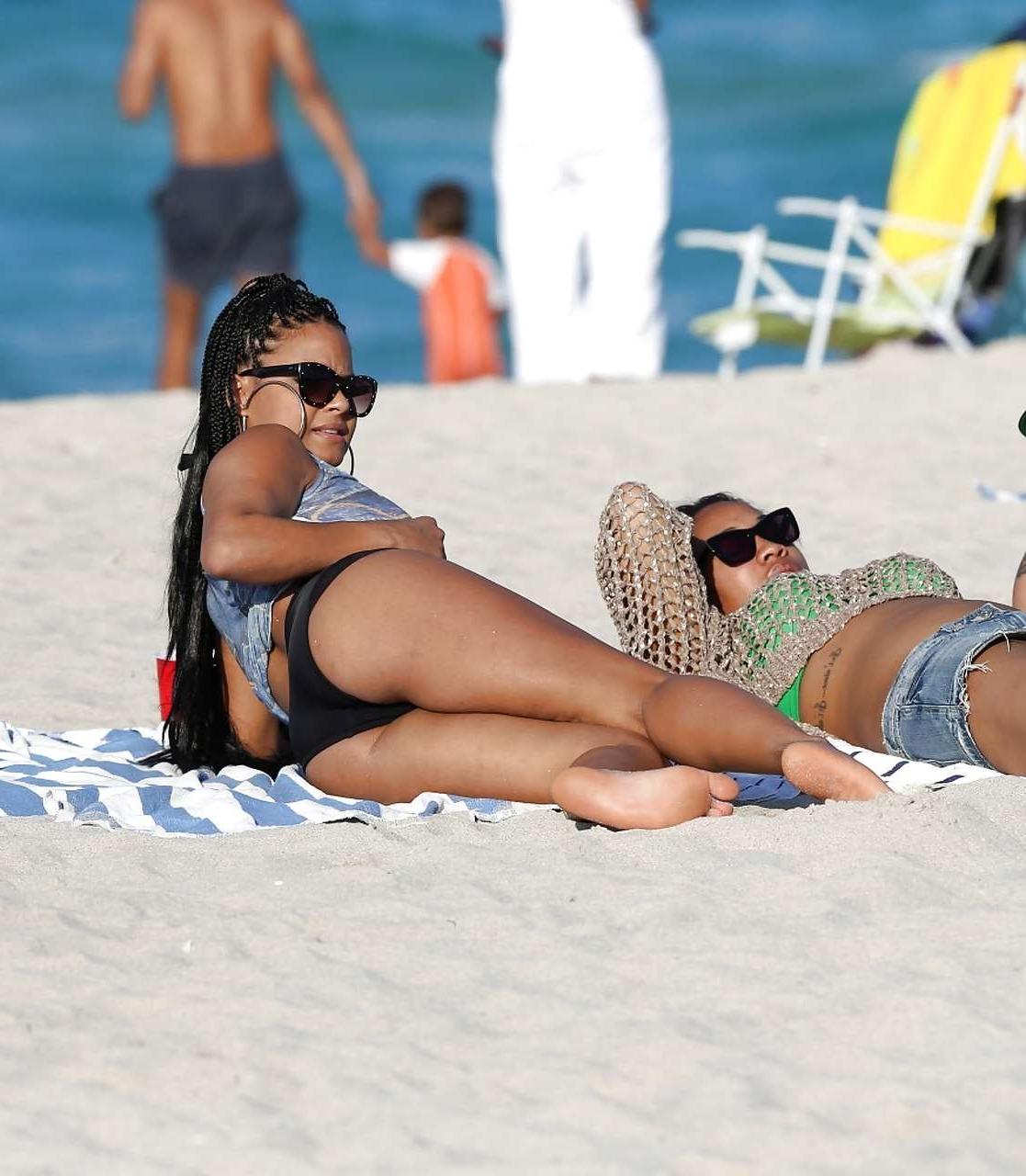 16P Christina Milian exposing nipples slip in bikini on beach