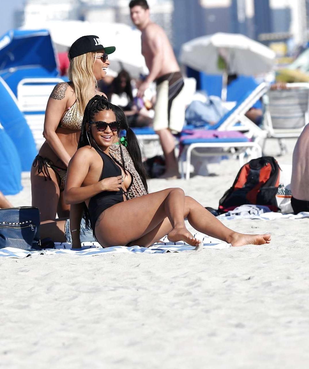 16P Christina Milian exposing nipples slip in bikini on beach