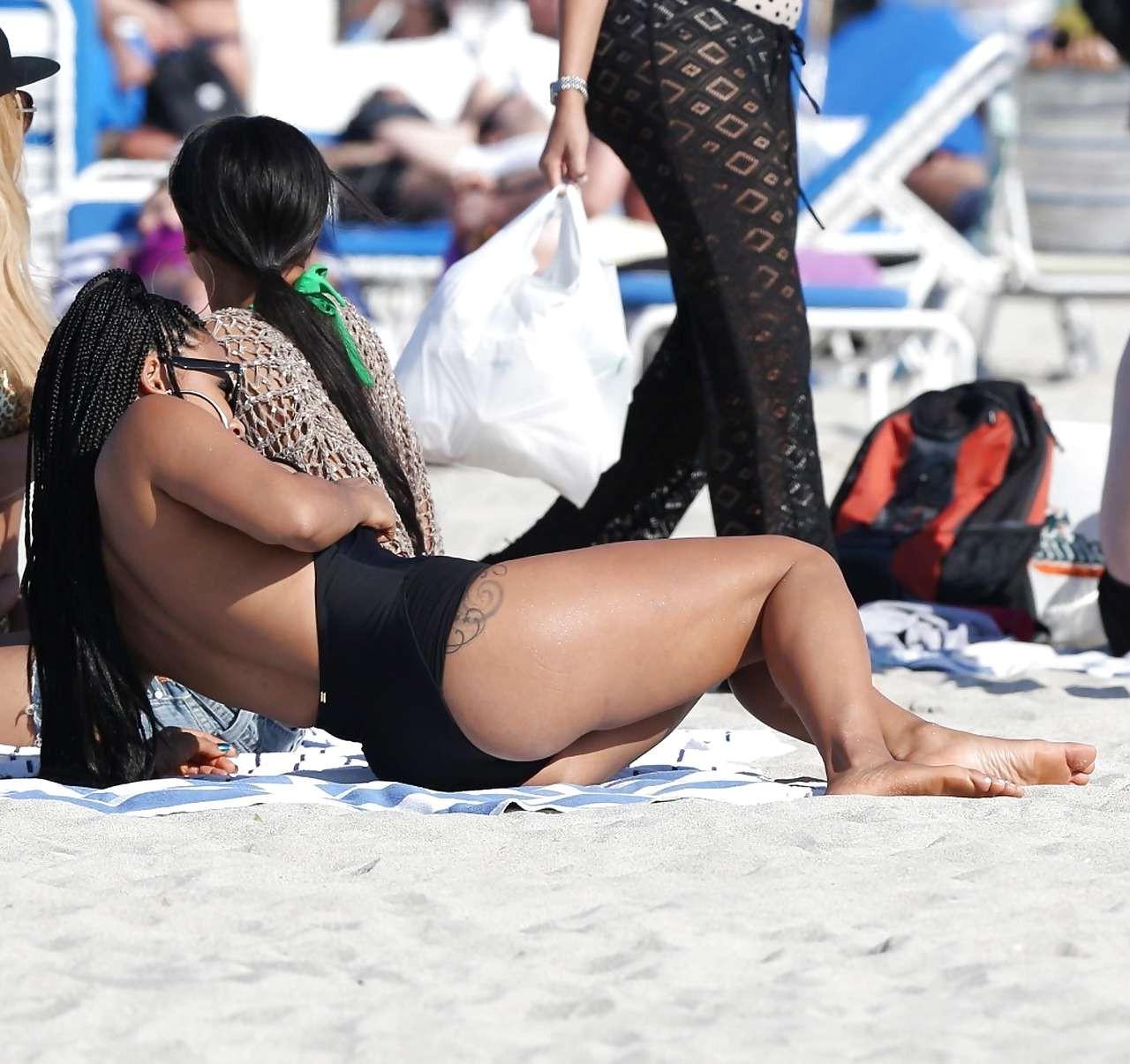 16P Christina Milian exposing nipples slip in bikini on beach