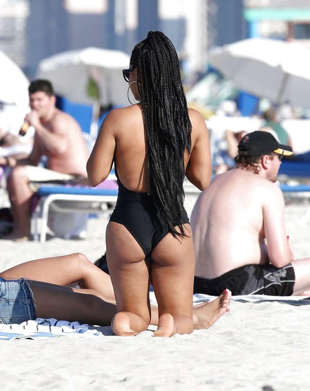 16P Christina Milian exposing nipples slip in bikini on beach