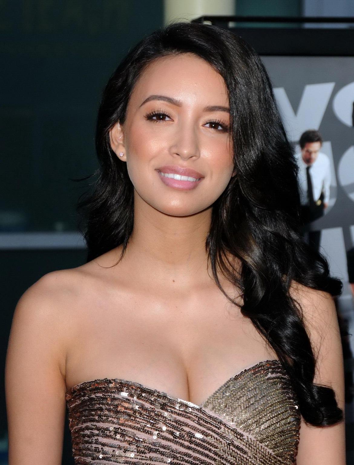 16P Christian Serratos shows huge cleavage wearing a tube mini dress at the 'Now You