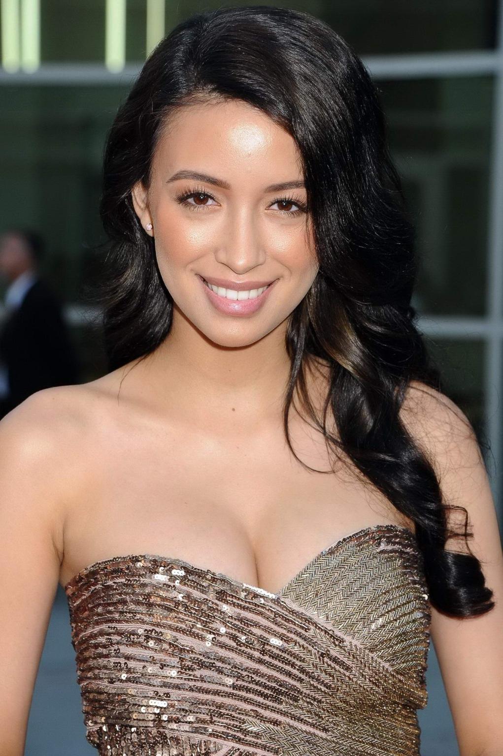 16P Christian Serratos shows huge cleavage wearing a tube mini dress at the 'Now You