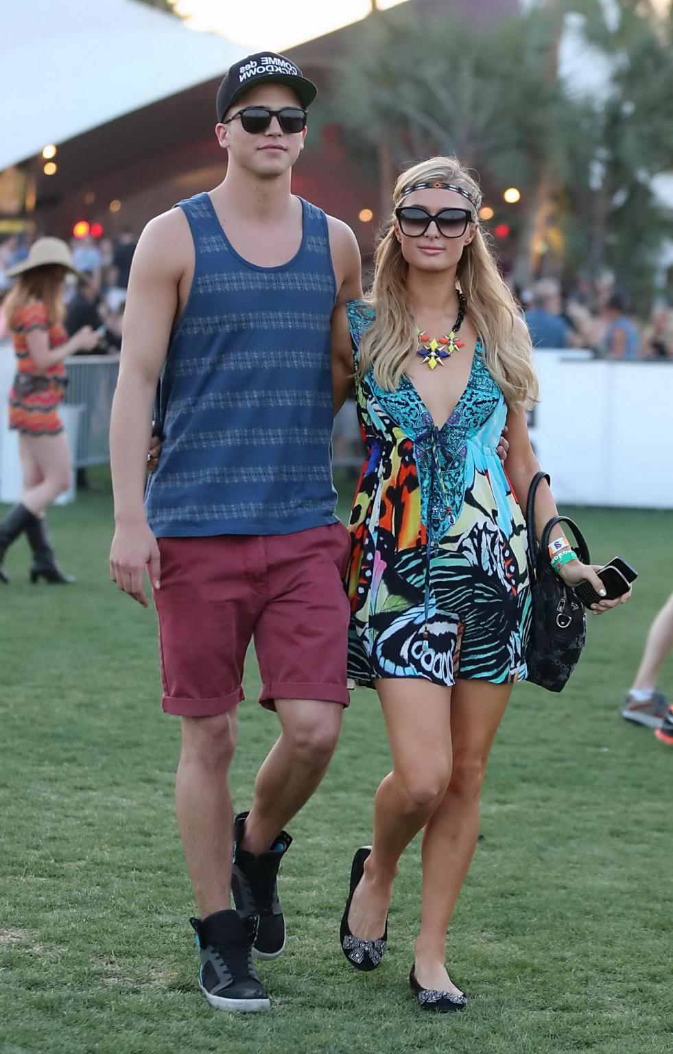 16P Paris Hilton braless showing huge cleavage in a colorful mini dress at 2013 Coac
