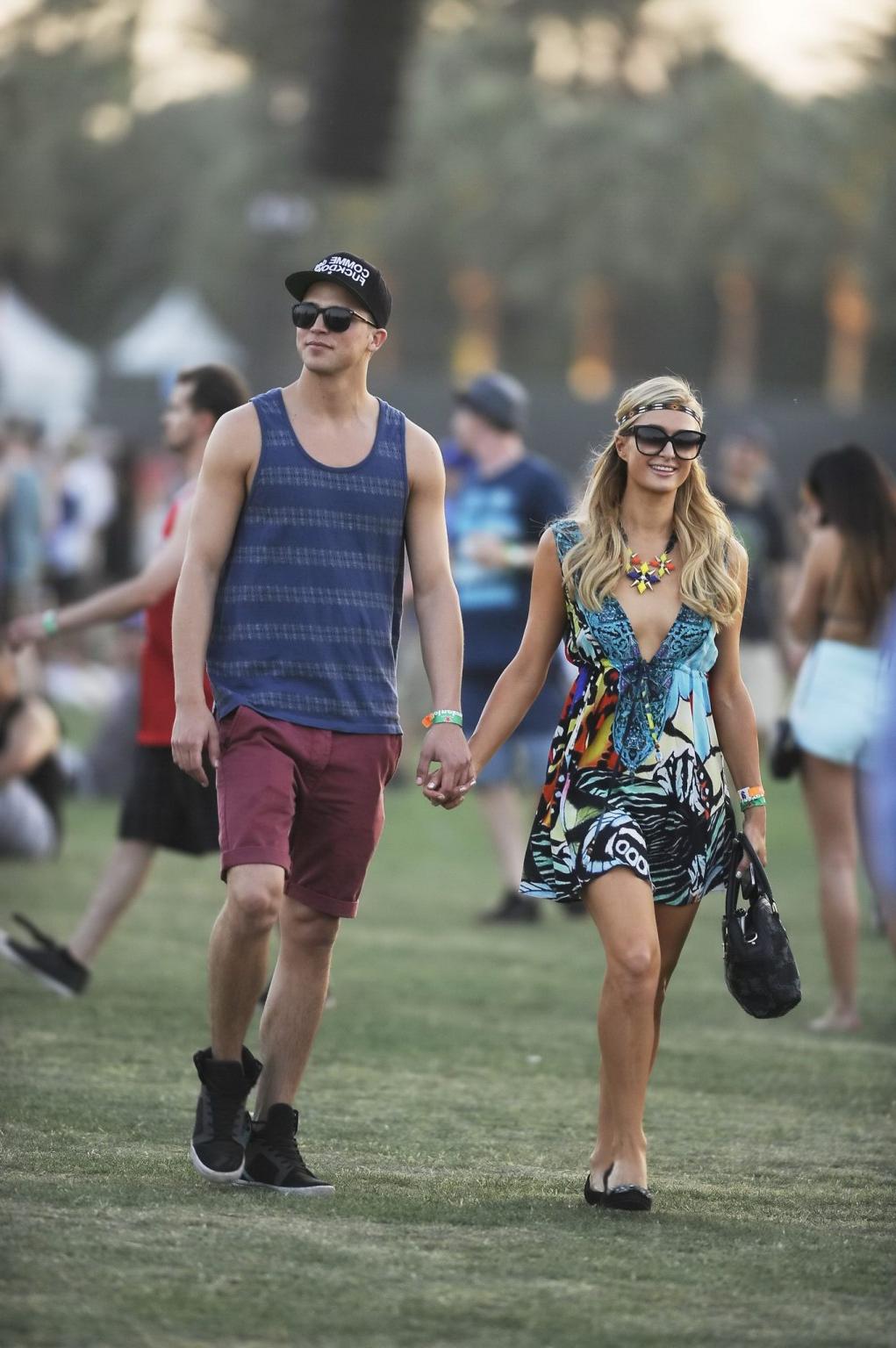 16P Paris Hilton braless showing huge cleavage in a colorful mini dress at 2013 Coac
