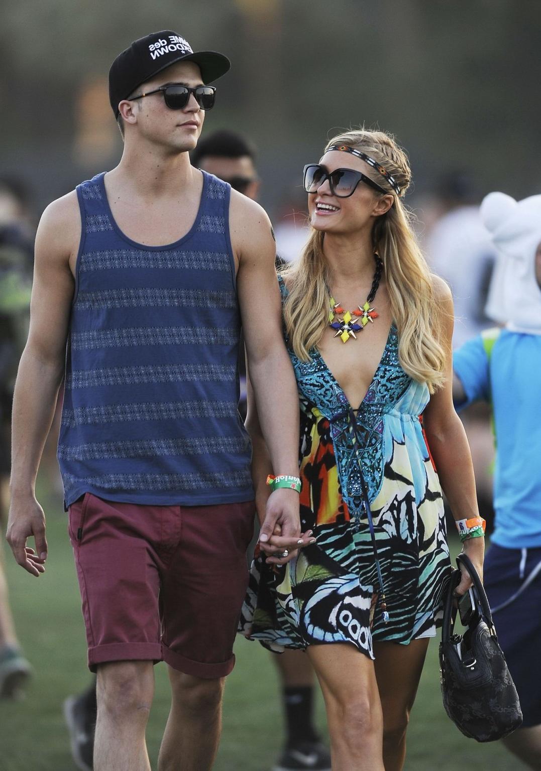16P Paris Hilton braless showing huge cleavage in a colorful mini dress at 2013 Coac