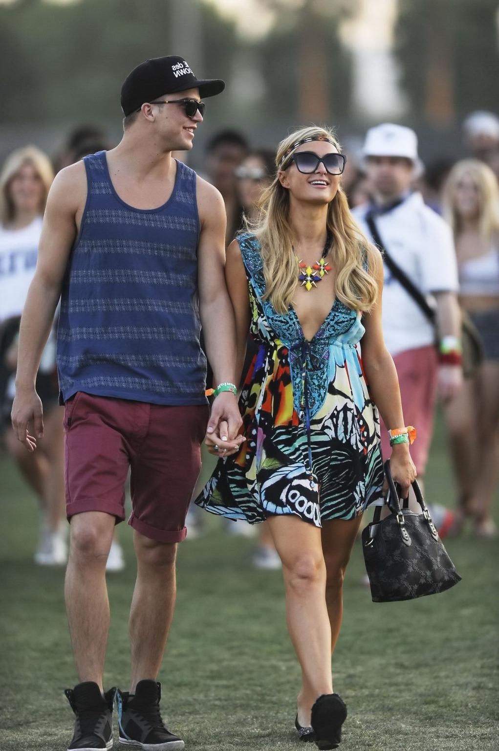 16P Paris Hilton braless showing huge cleavage in a colorful mini dress at 2013 Coac