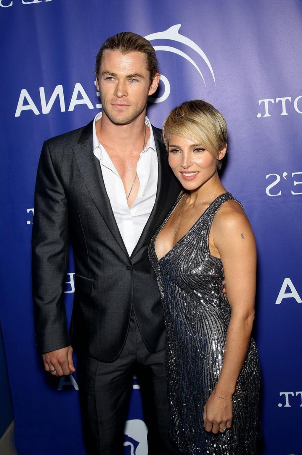 16P Elsa Pataky braless showing huge cleavage in a shiny gray backless mini dress at