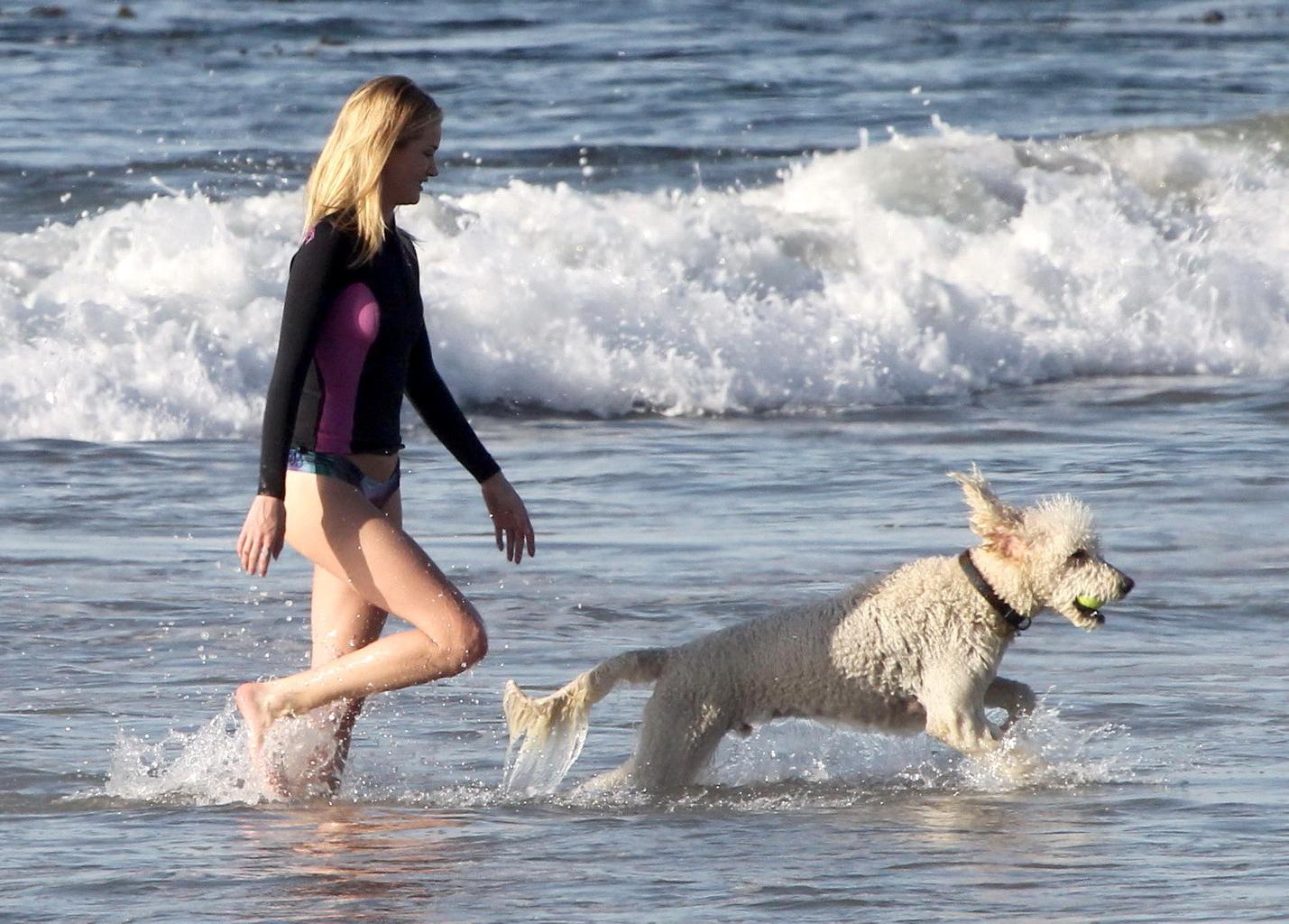 16P Rosie Huntington-Whiteley shows off her ass in bikini bottom while playing with 