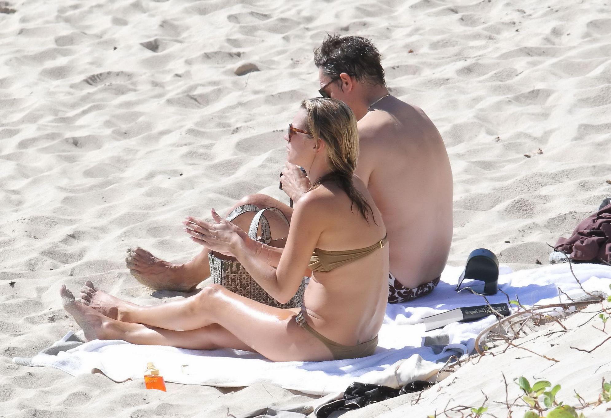 8P Kate Moss nipple slip wearing olive tube bikini at the beach in St.Barts