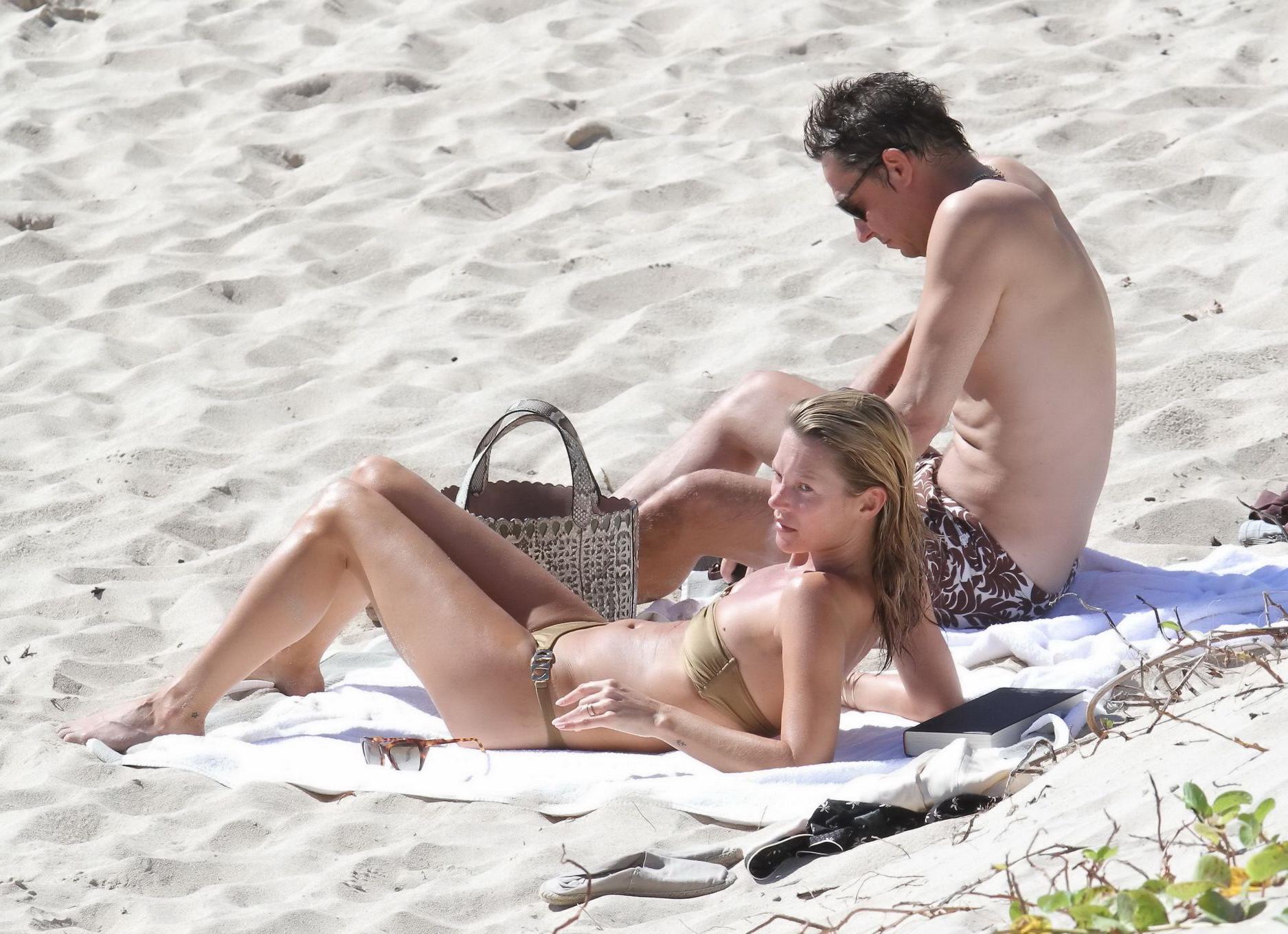 8P Kate Moss nipple slip wearing olive tube bikini at the beach in St.Barts