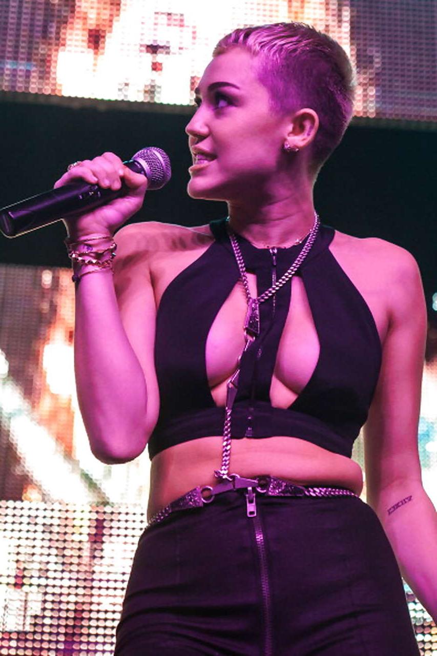8P Miley Cyrus performing and showing huge cleavage on stage