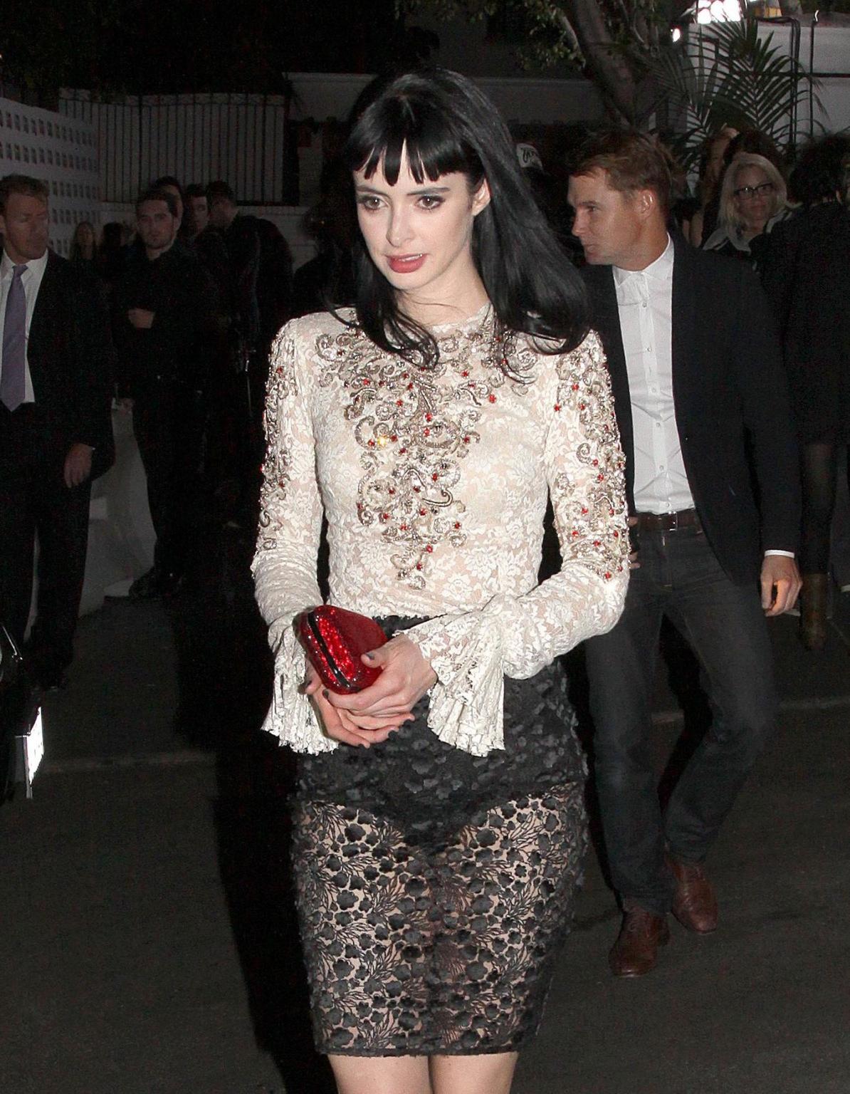 9P Krysten Ritter wearing a partially see through lace dress at GQ Men of The Year 