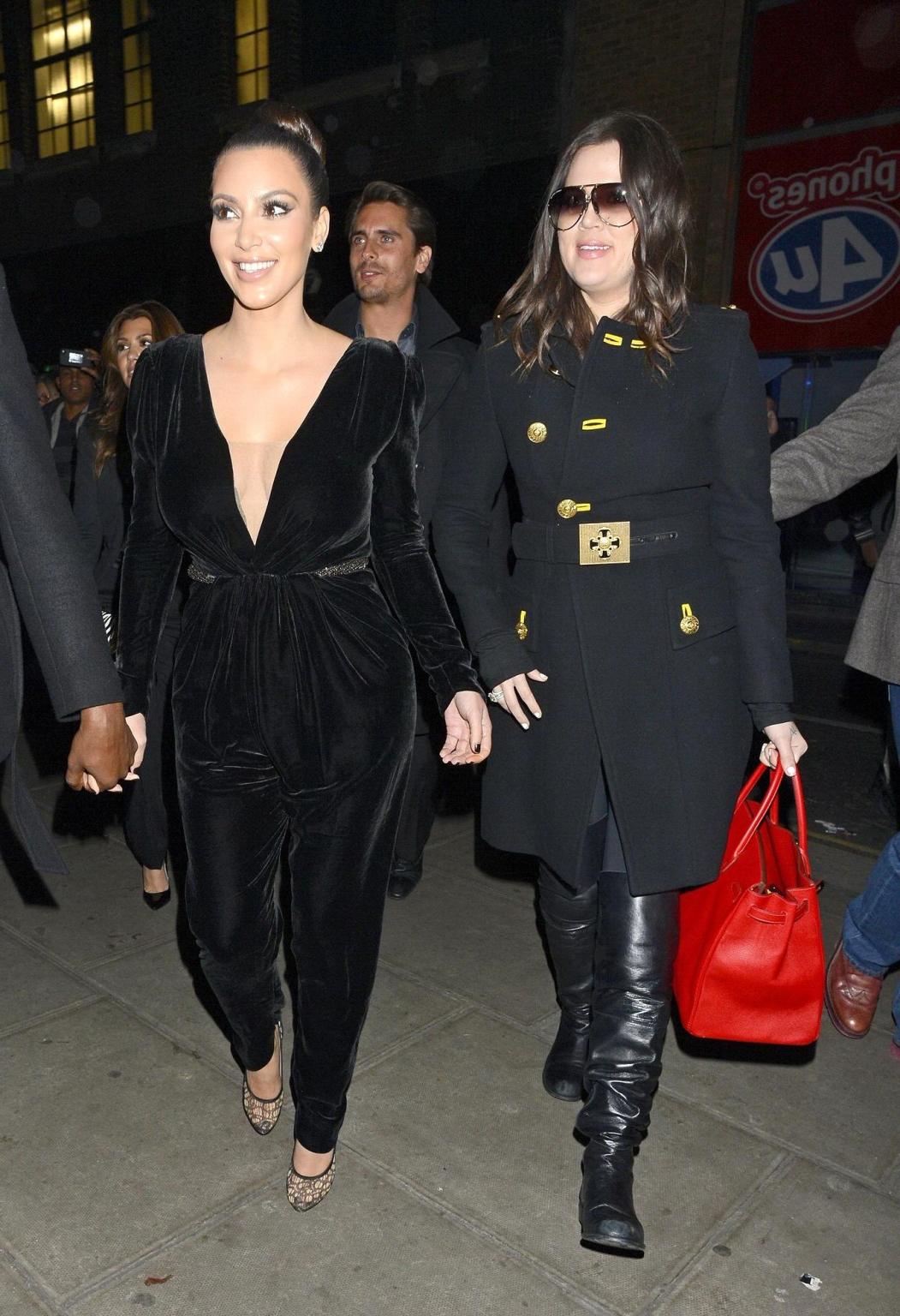 10P Kim Kardashian shows cleavage  pokies wearing a sexy black outfit outside a rest