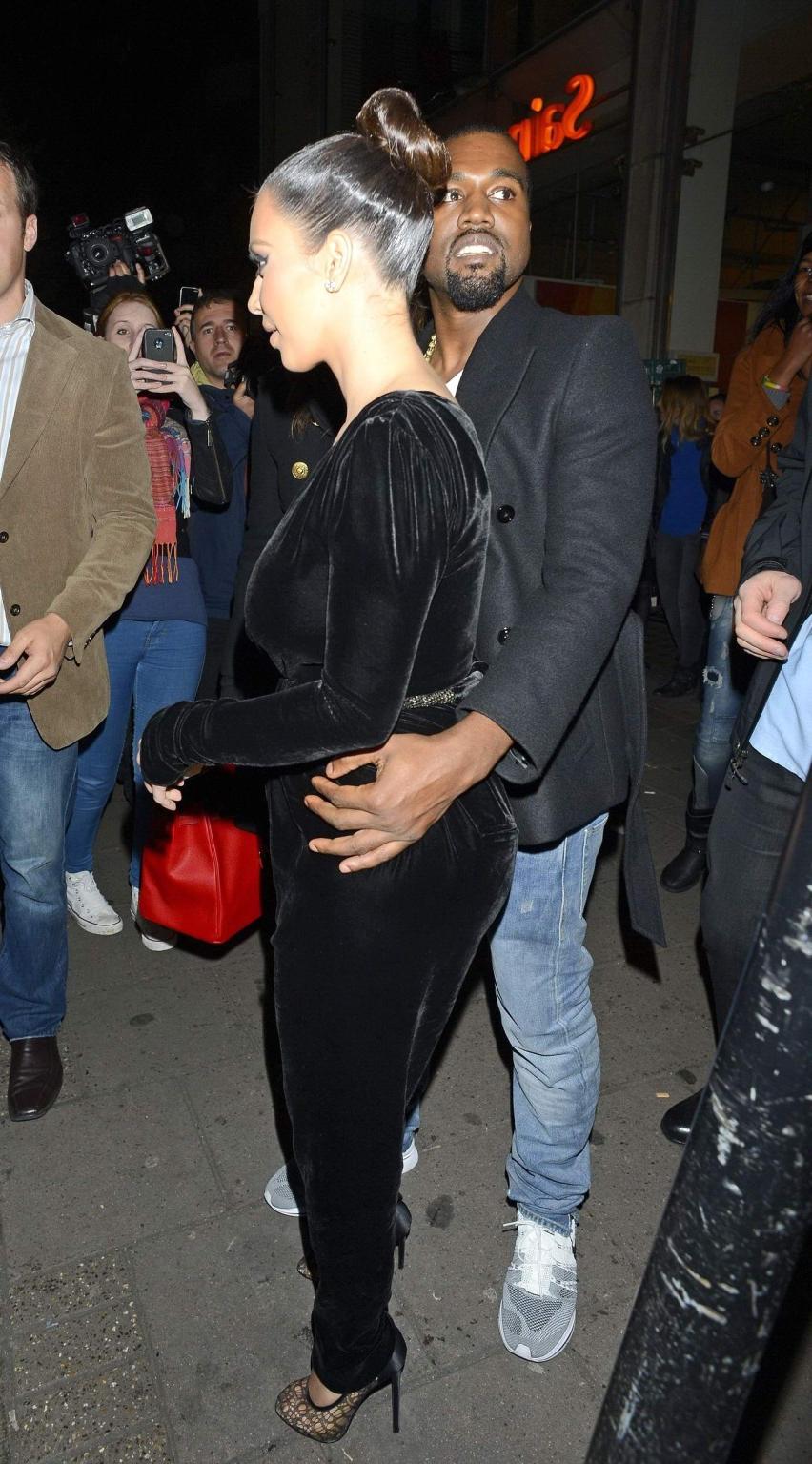 10P Kim Kardashian shows cleavage  pokies wearing a sexy black outfit outside a rest