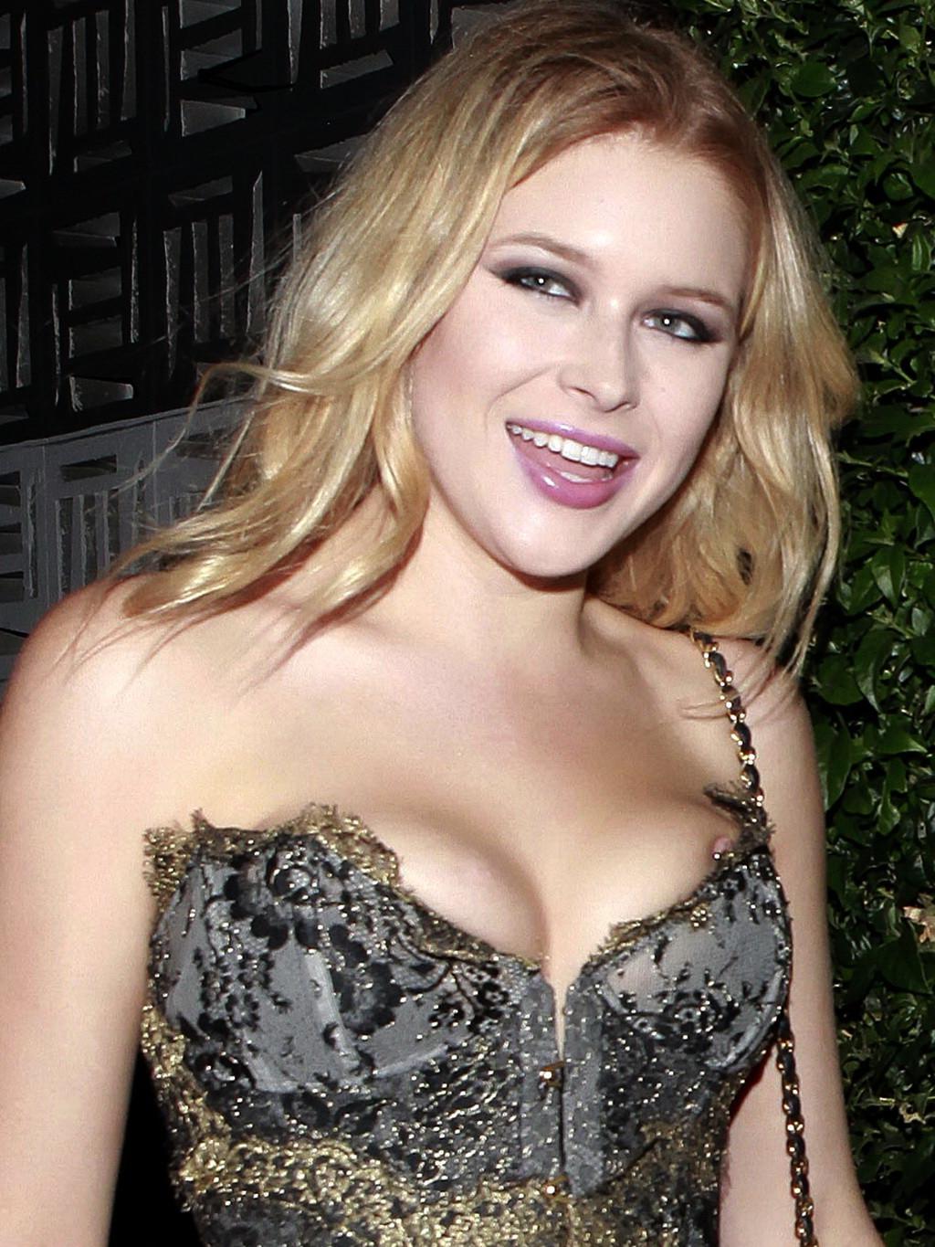 9P Renee Olstead pierced nipple slip at Dita Von Teese Collection Launch Party in L