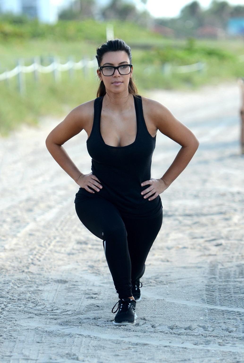 10P Kim Kardashian showing her sweaty cleavage  booty after a morning workout on a b