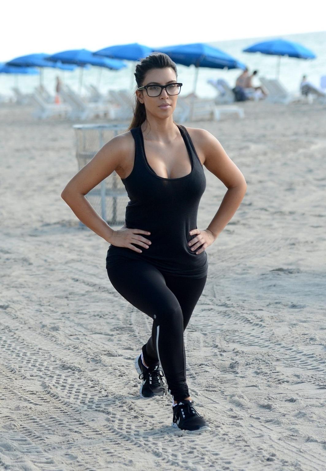 10P Kim Kardashian showing her sweaty cleavage  booty after a morning workout on a b