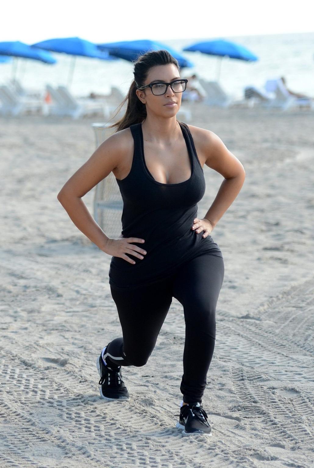 10P Kim Kardashian showing her sweaty cleavage  booty after a morning workout on a b