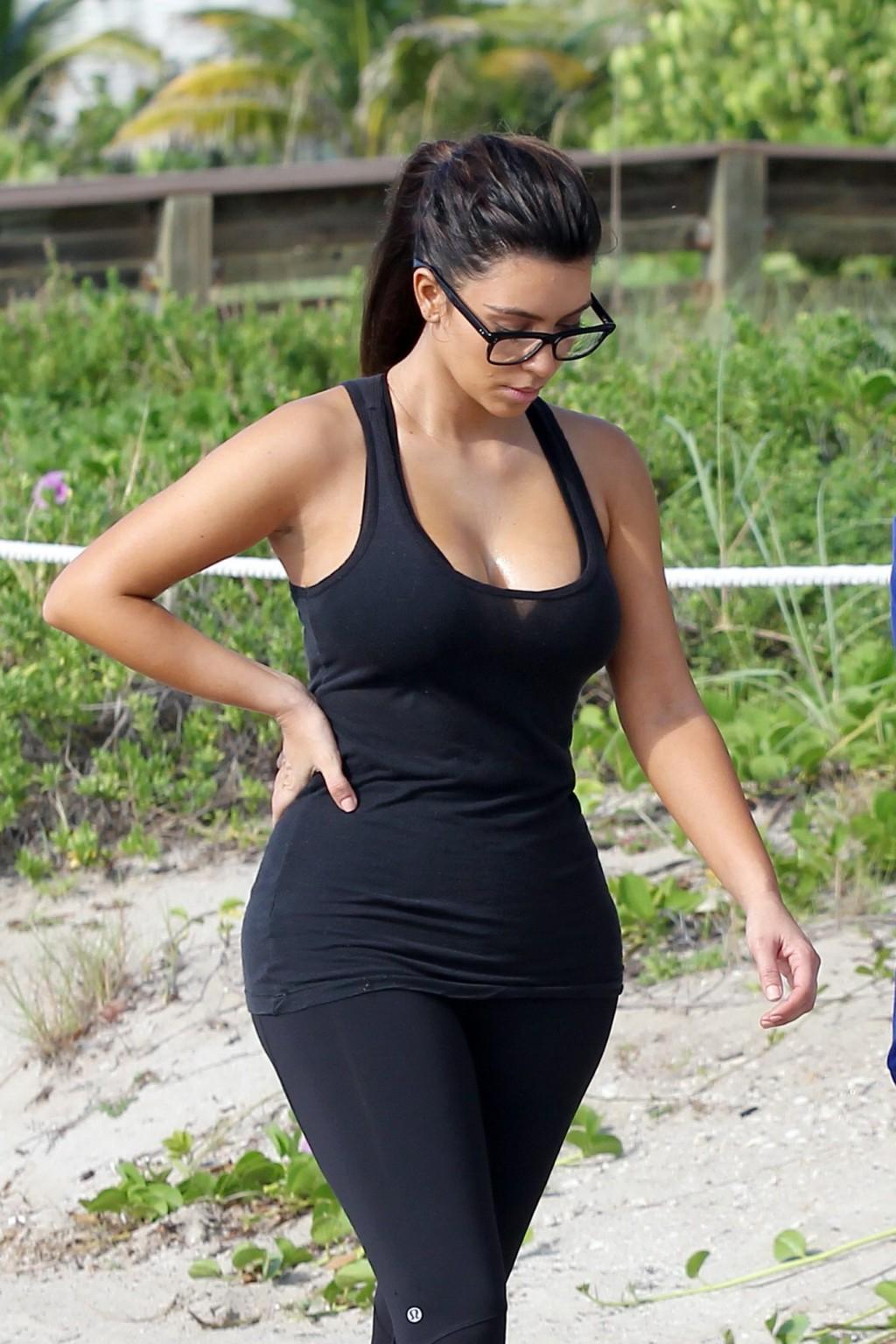 10P Kim Kardashian showing her sweaty cleavage  booty after a morning workout on a b