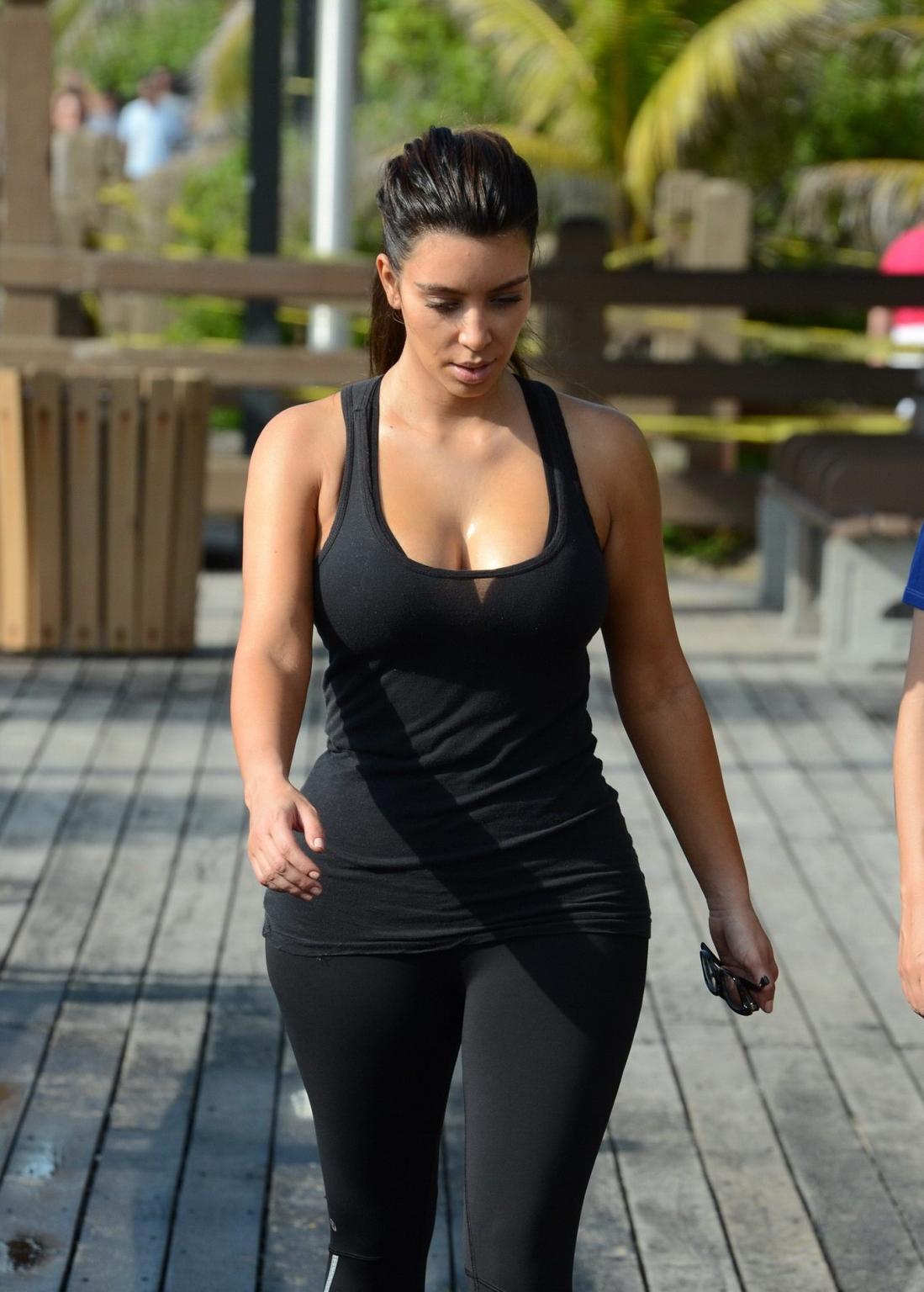 10P Kim Kardashian showing her sweaty cleavage  booty after a morning workout on a b